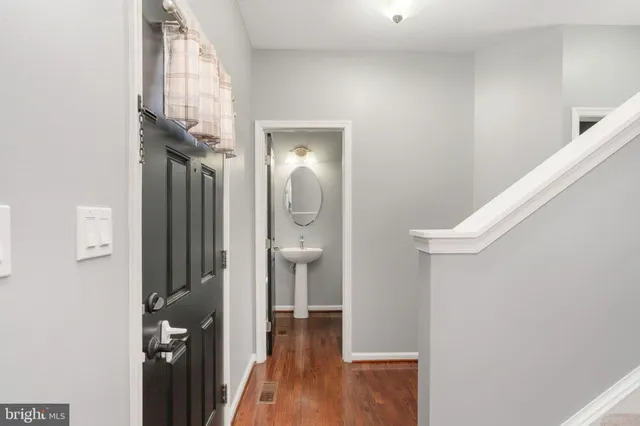 a kitchen with stainless steel appliances granite countertop sink stove top oven and cabinets
