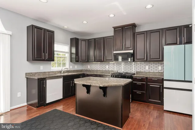 a living room with fireplace furniture and a flat screen tv