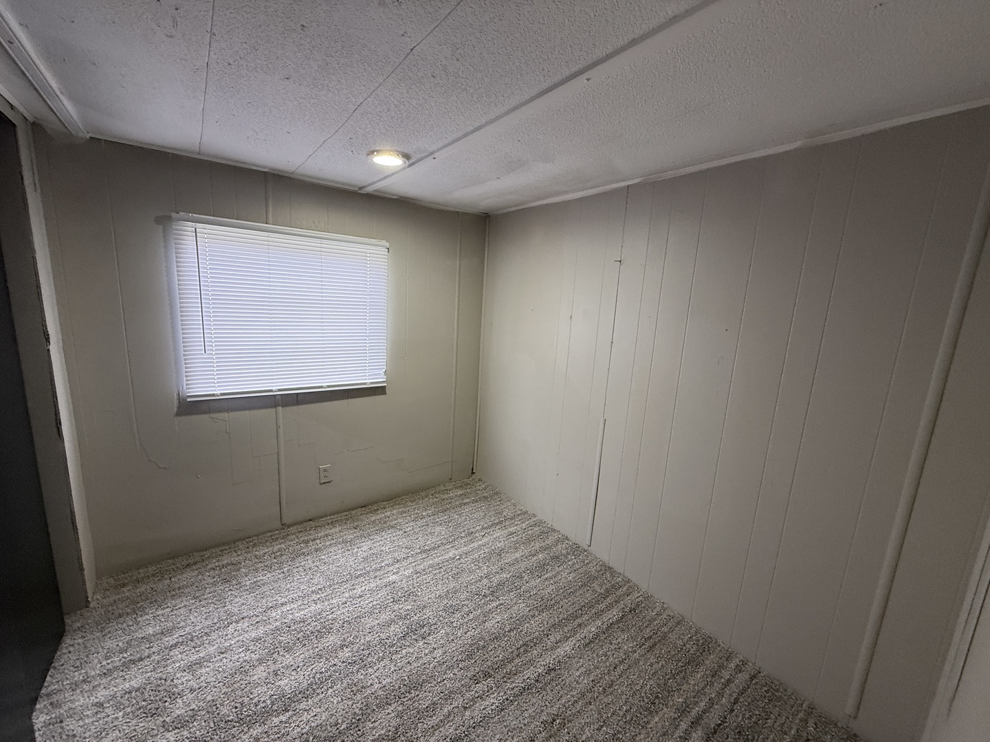 1712 South Dixie Highway, Unit 27 Crete, IL 60417 - Photo 11 of 13 a view of an empty room with wooden floor and a window