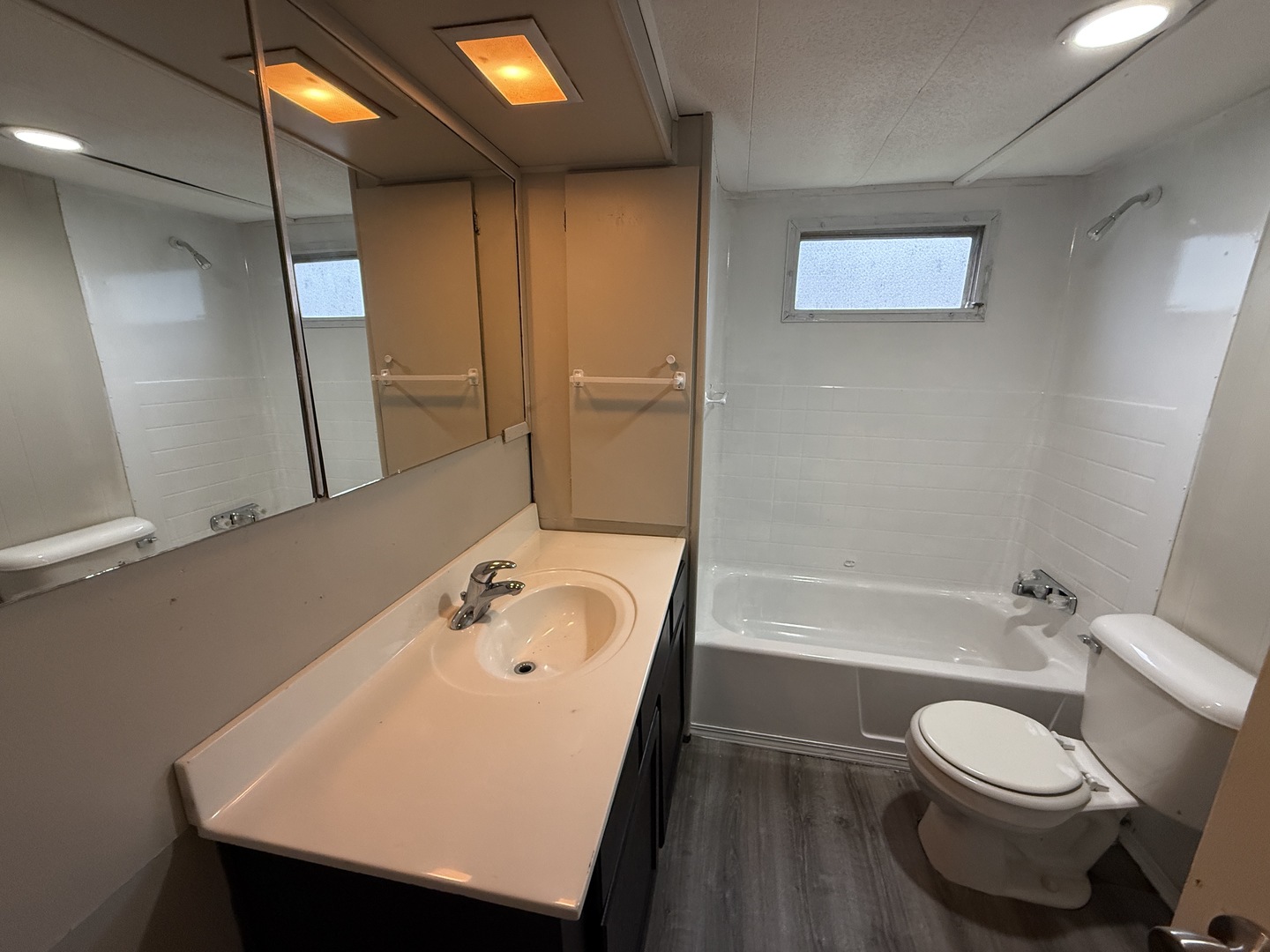 1712 South Dixie Highway, Unit 27 Crete, IL 60417 - Photo 12 of 13 a bathroom with a sink a toilet and shower
