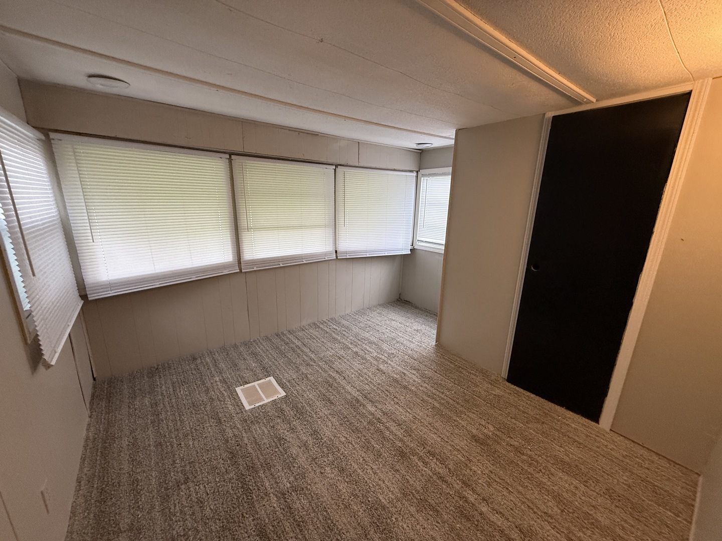 1712 South Dixie Highway, Unit 27 Crete, IL 60417 - Photo 13 of 13 a view of empty room with wooden floor and fan