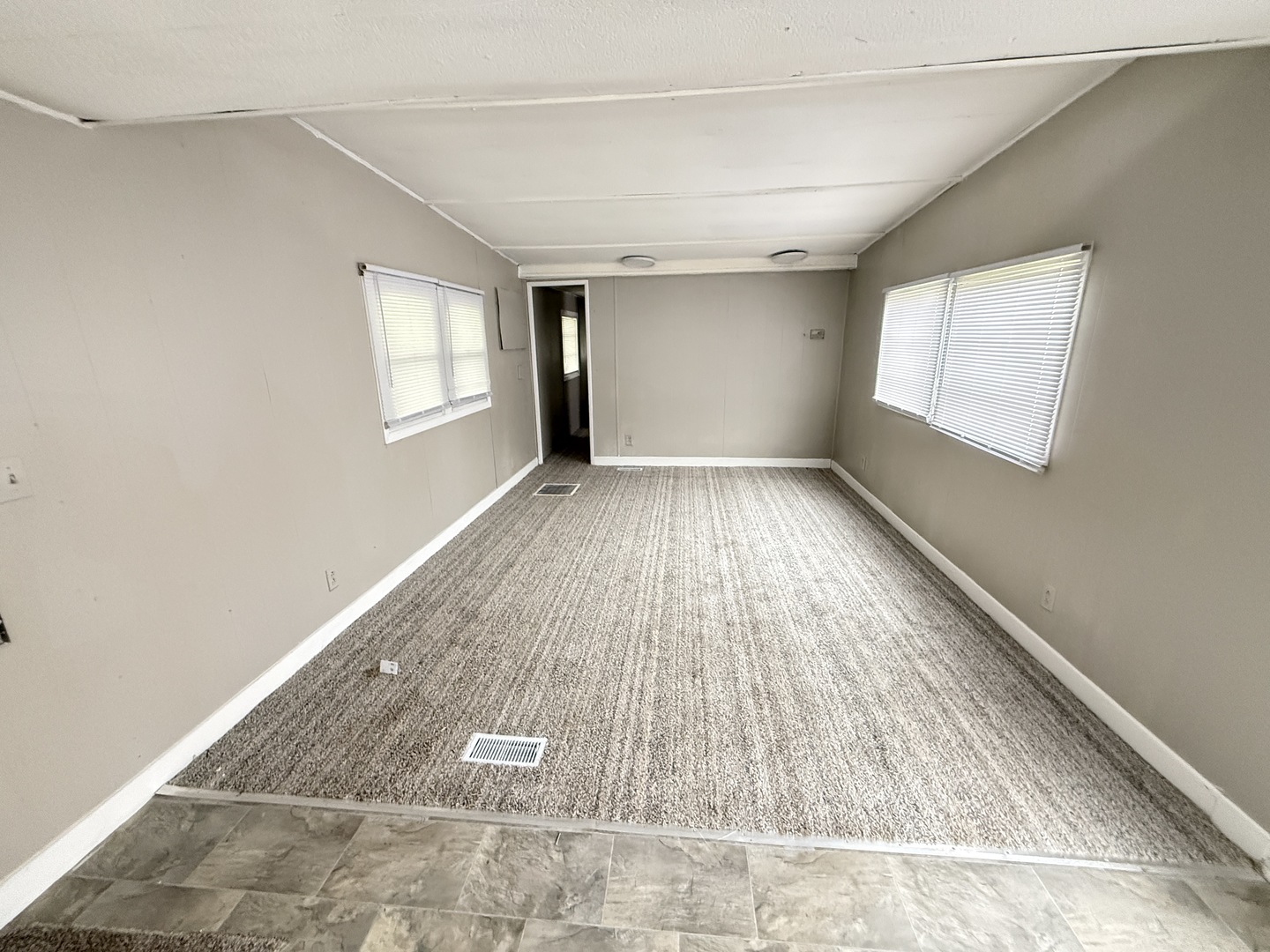 1712 South Dixie Highway, Unit 27 Crete, IL 60417 - Photo 7 of 13 wooden floor in an empty room with a window