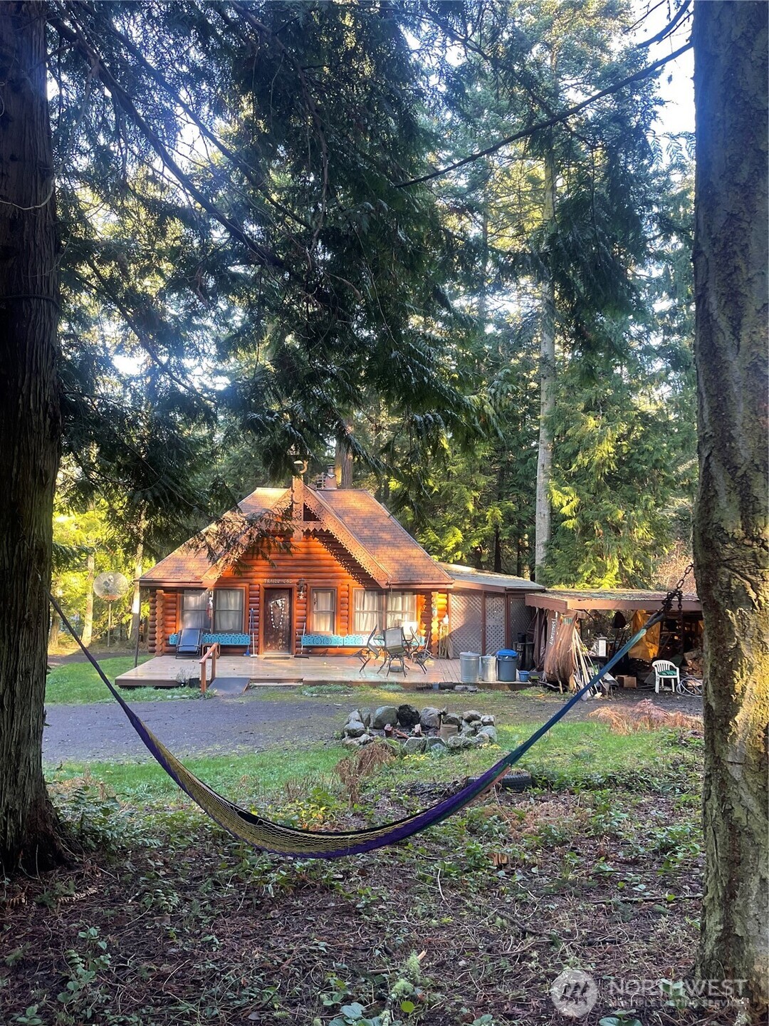 a backyard of a house with outdoor seating