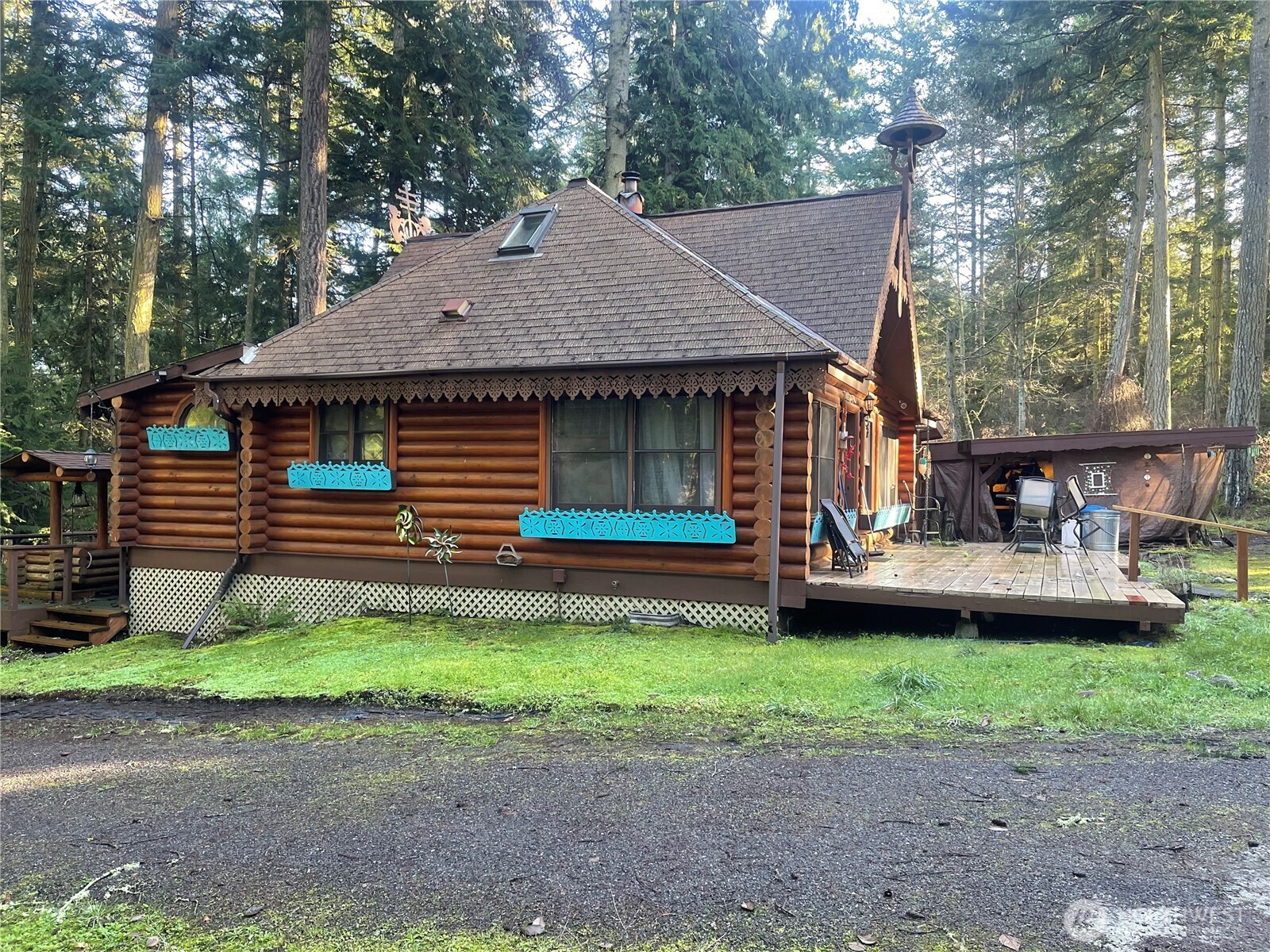 276 Point Caution Drive Friday Harbor, WA 98250 - Photo 12 of 21 a front view of a house with a garden and trees