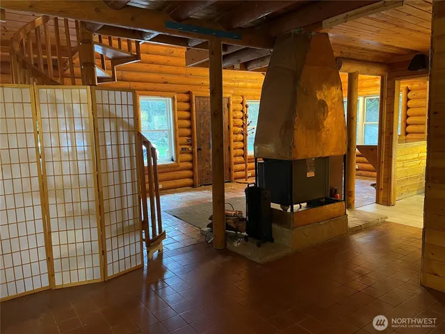 a view of a door and wooden floor