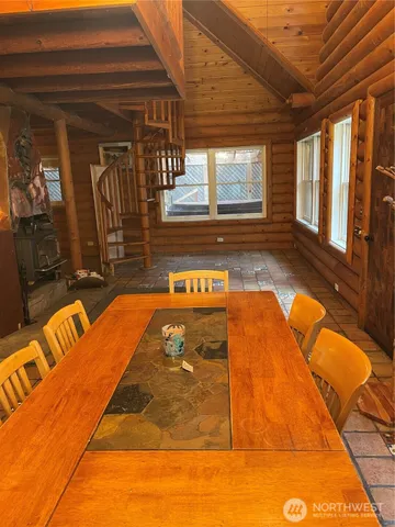 a dinning table and chairs in the balcony