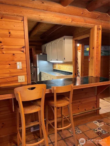 a room with furniture and large windows