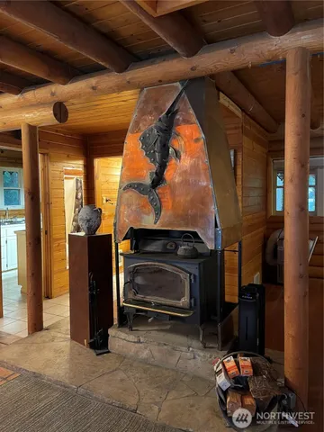 a view of a chair and tables in the patio