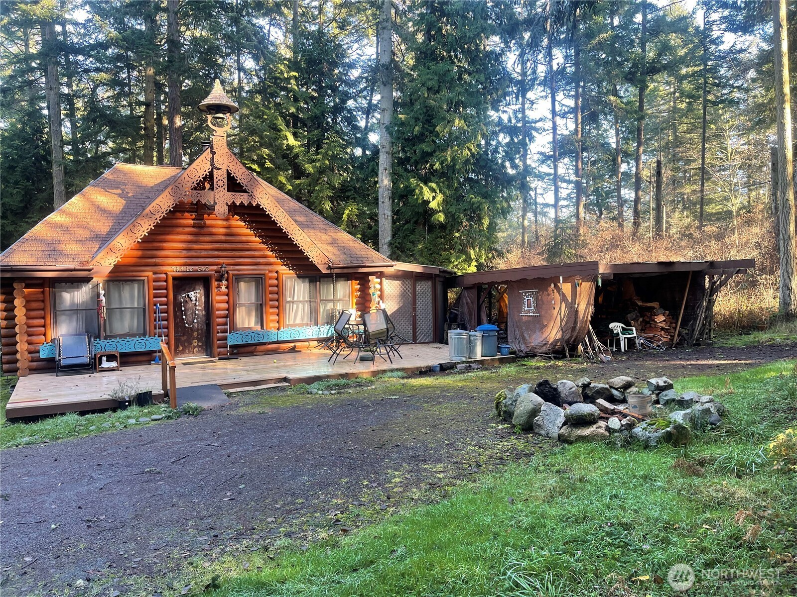 276 Point Caution Drive Friday Harbor, WA 98250 - Photo 8 of 21 a front view of a house with a yard table and chairs