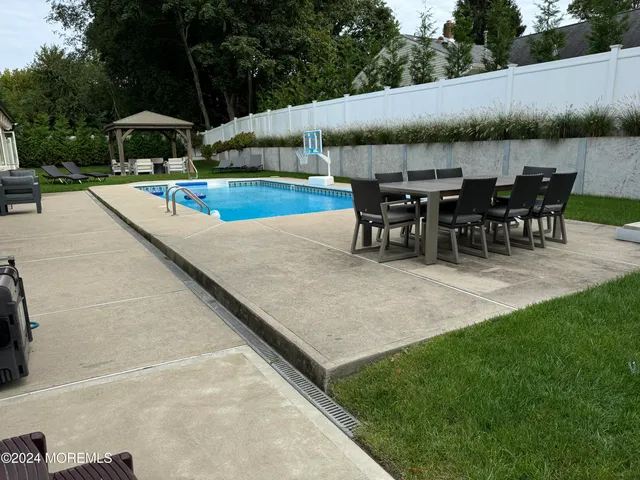 an outdoor space with furniture and umbrella