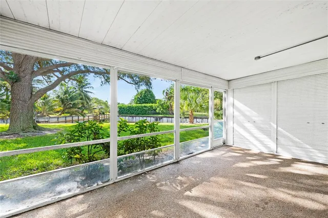 a view of a garden with an outdoor seating space