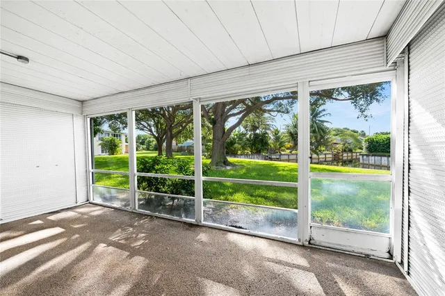 a view of a room with a large window