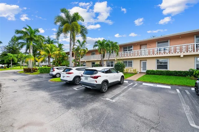 a view of a car is parked in front of a house
