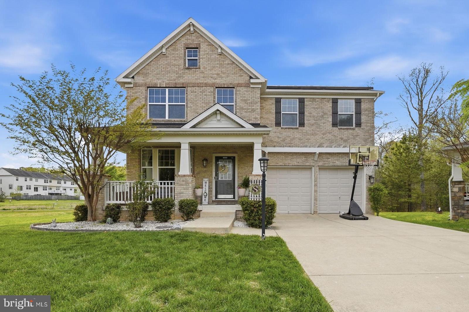 6900 Lenape Court Brandywine, MD 20613 - Photo 1 of 43 a front view of a house with a yard