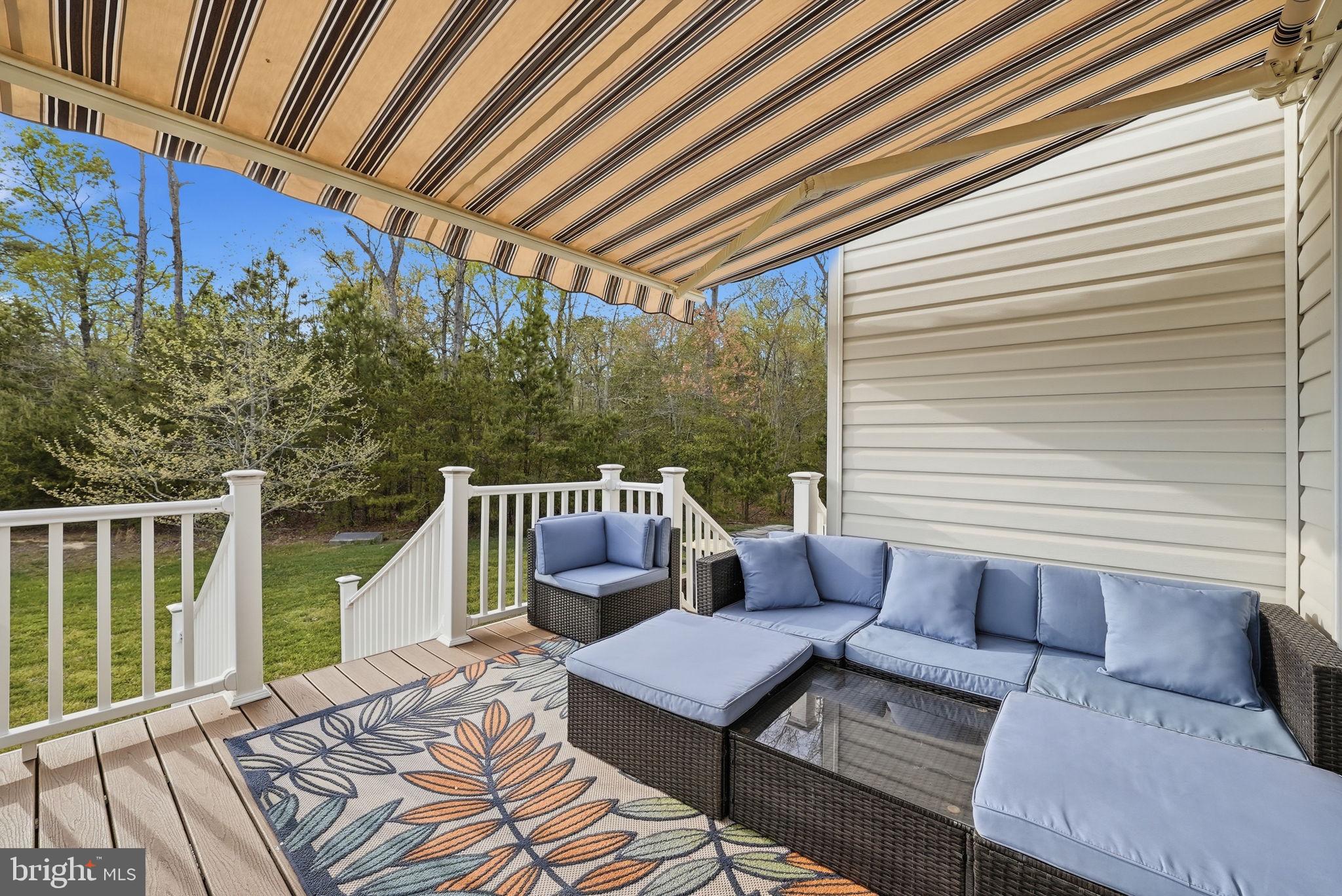 6900 Lenape Court Brandywine, MD 20613 - Photo 11 of 43 a balcony with furniture and wooden floor