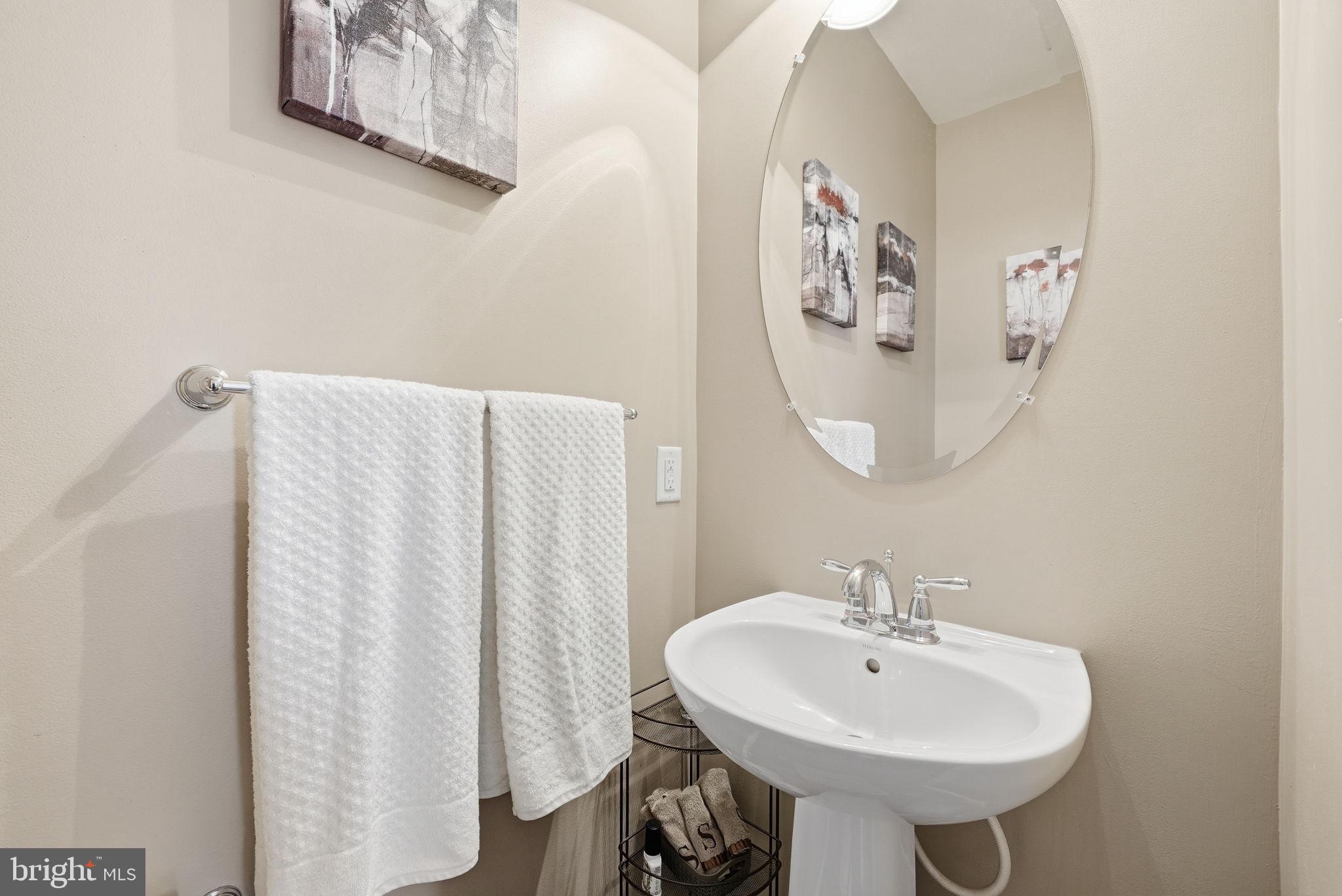 6900 Lenape Court Brandywine, MD 20613 - Photo 16 of 43 a bathroom with a sink and mirror