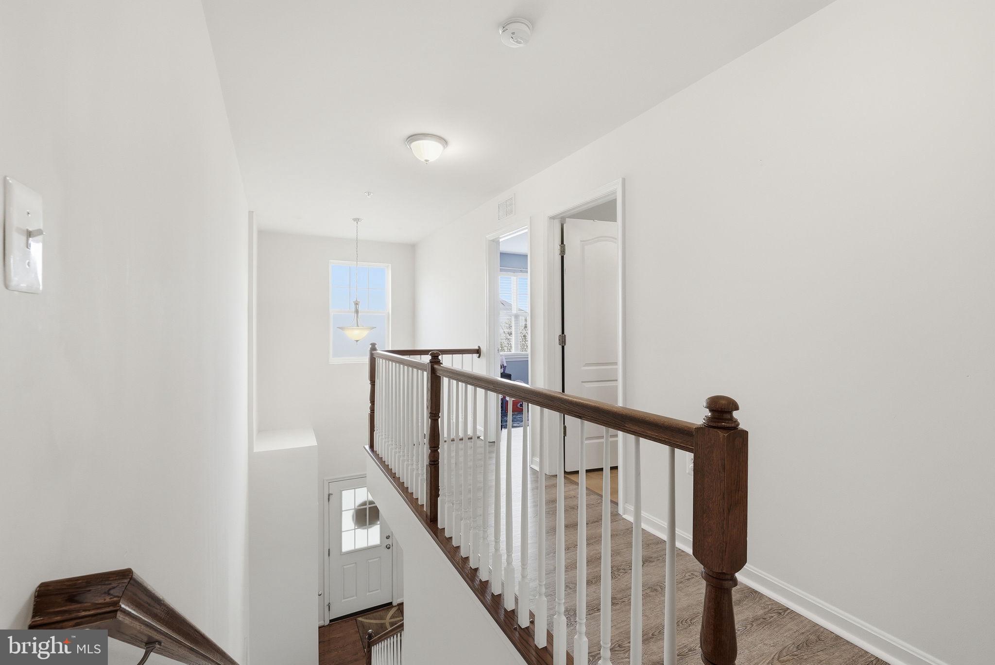 6900 Lenape Court Brandywine, MD 20613 - Photo 17 of 43 a view of staircase with railing and white walls