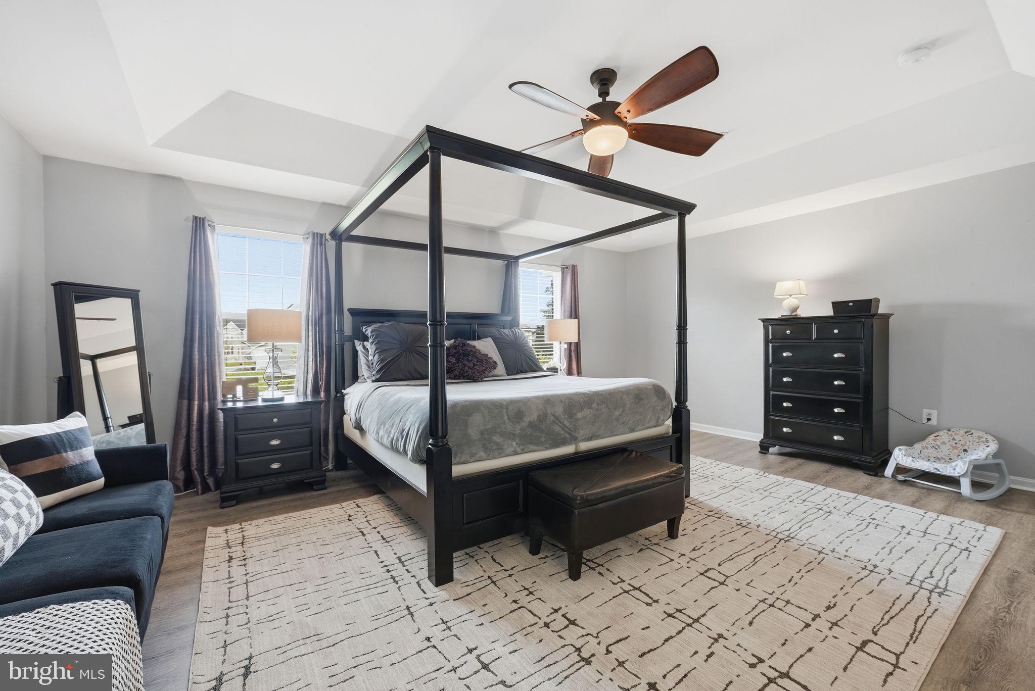 6900 Lenape Court Brandywine, MD 20613 - Photo 19 of 43 a bedroom with a bed a couch and dresser