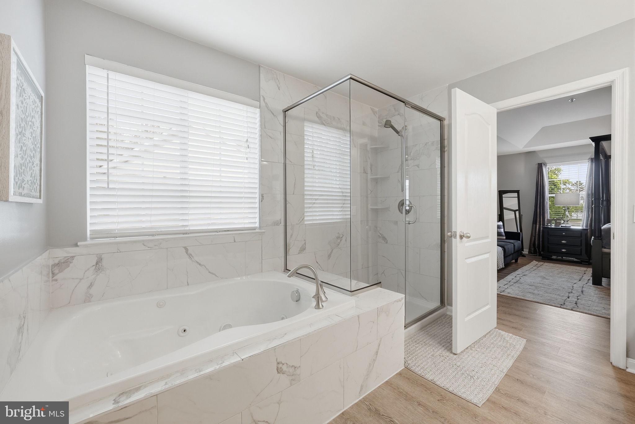 6900 Lenape Court Brandywine, MD 20613 - Photo 21 of 43 a bathroom with a bathtub and a shower