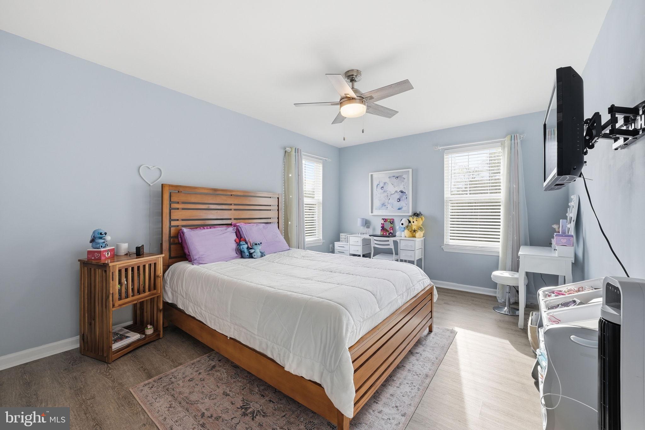 6900 Lenape Court Brandywine, MD 20613 - Photo 25 of 43 a bedroom with a bed and a chandelier
