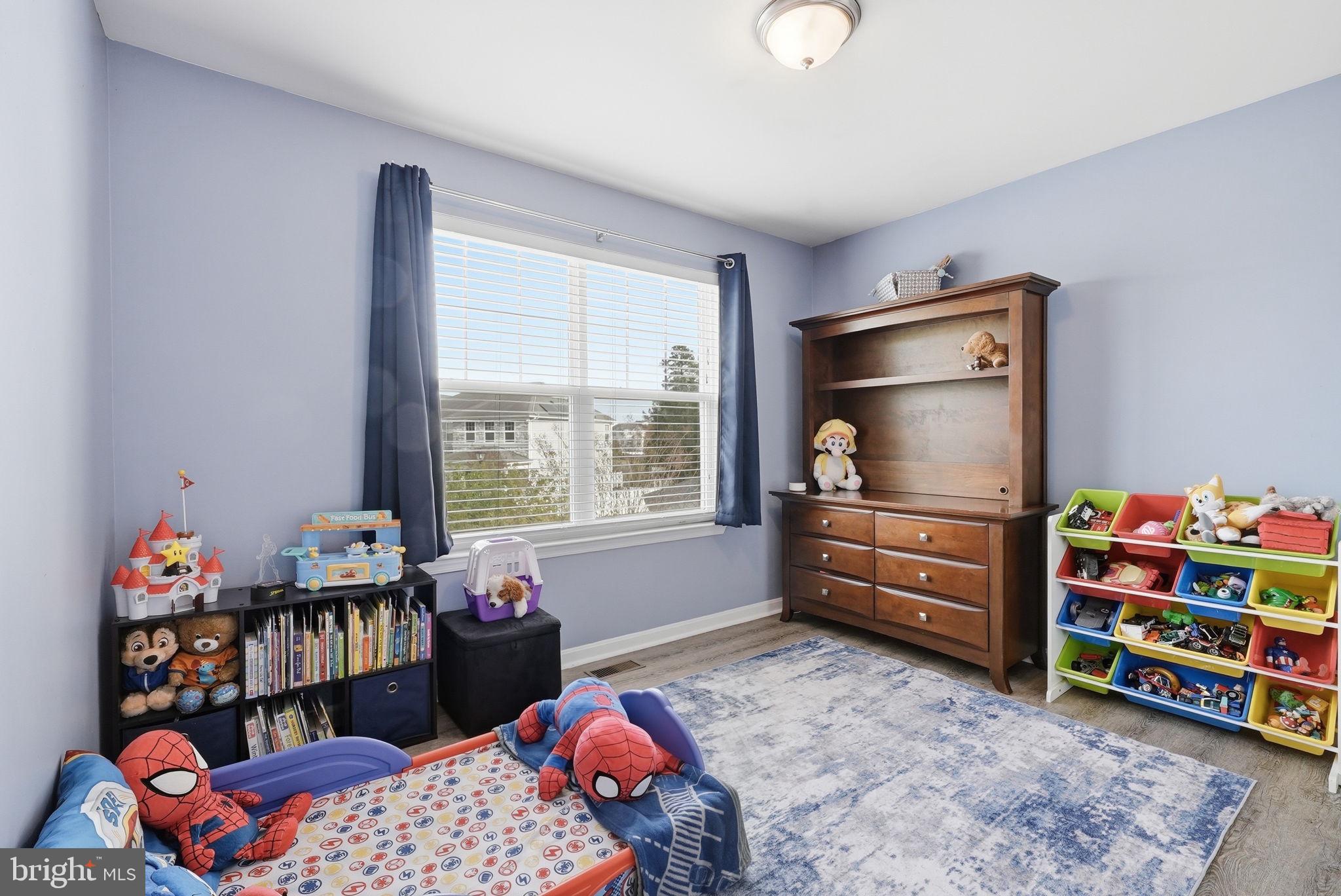 6900 Lenape Court Brandywine, MD 20613 - Photo 28 of 43 a bedroom with baby crib and a window