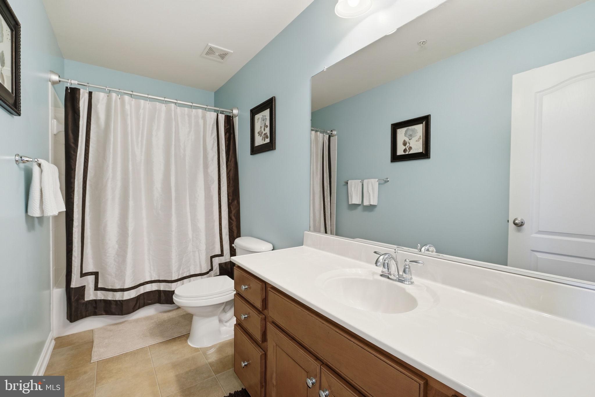 6900 Lenape Court Brandywine, MD 20613 - Photo 29 of 43 a bathroom with a sink toilet and shower
