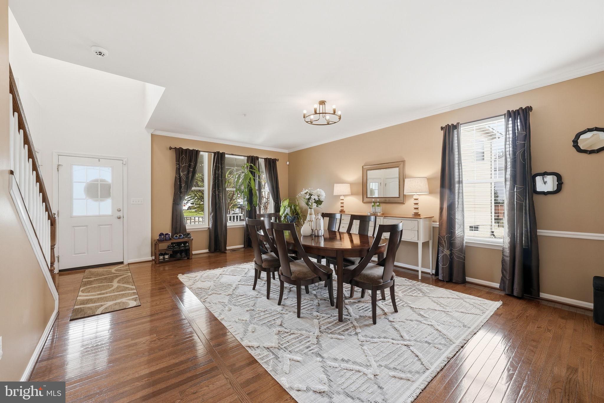 6900 Lenape Court Brandywine, MD 20613 - Photo 3 of 43 a view of a dining room with furniture and wooden floor