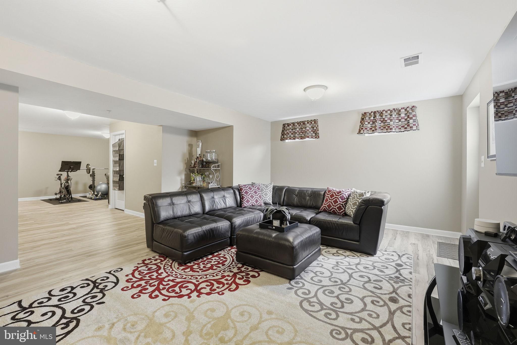 6900 Lenape Court Brandywine, MD 20613 - Photo 31 of 43 a living room with furniture and a couch