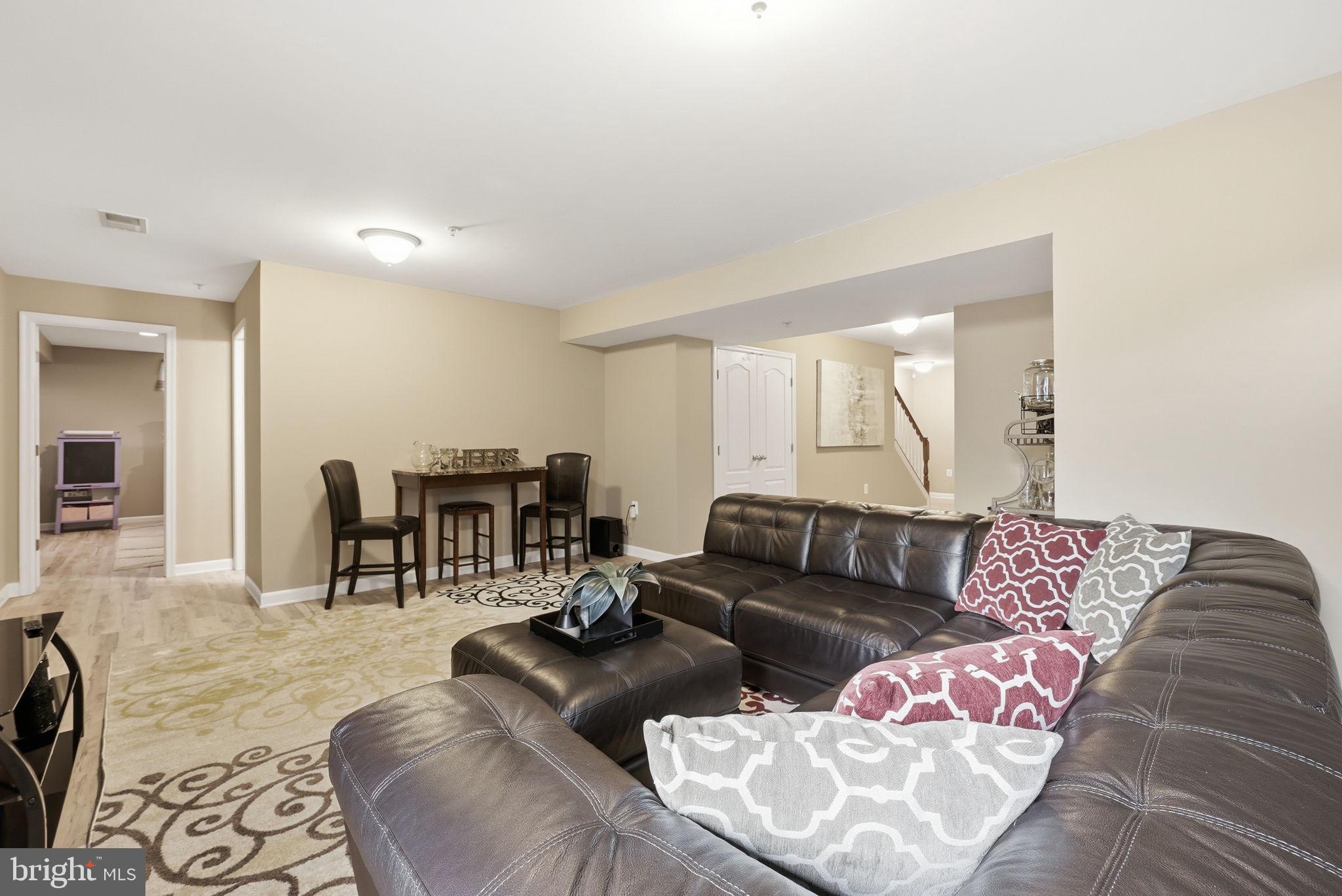 6900 Lenape Court Brandywine, MD 20613 - Photo 33 of 43 a living room with furniture and a large window