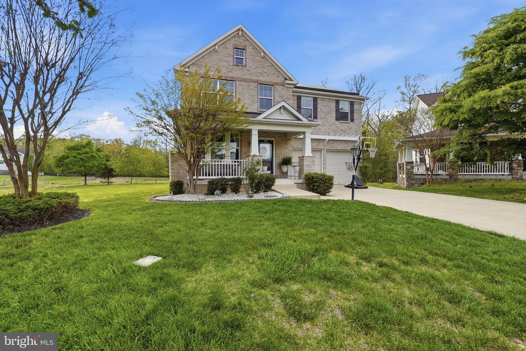 6900 Lenape Court Brandywine, MD 20613 - Photo 38 of 43 a front view of a house with a yard