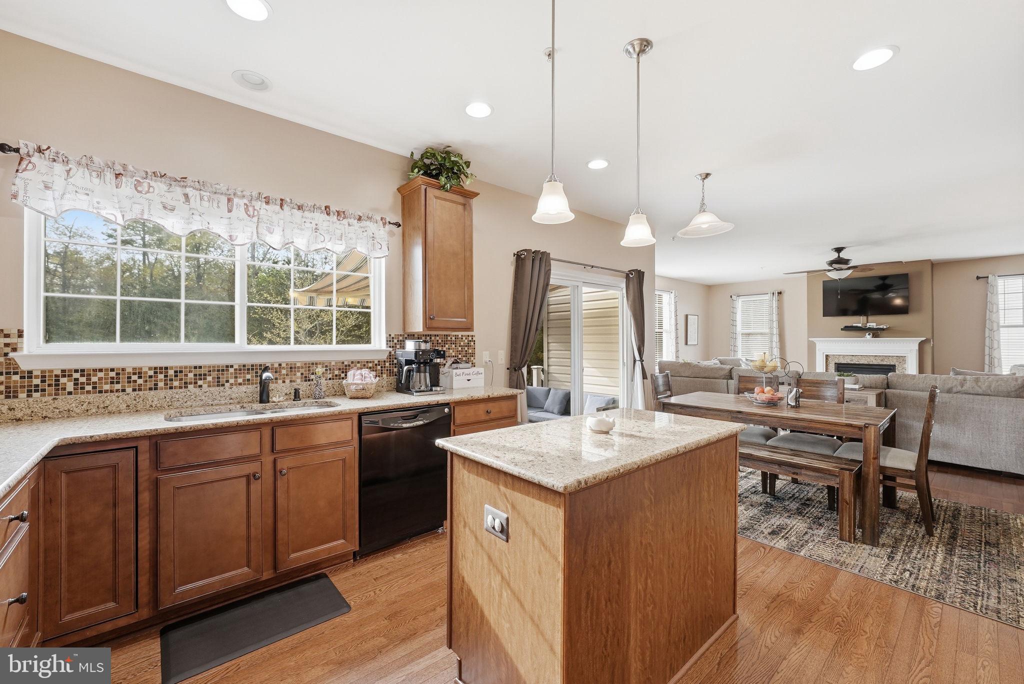 6900 Lenape Court Brandywine, MD 20613 - Photo 8 of 43 a open kitchen with stainless steel appliances granite countertop a sink and a stove