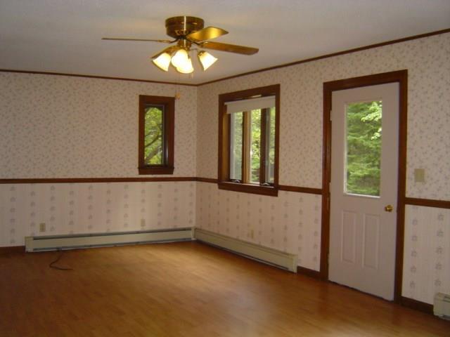54 Station Road Oxford, ME 04270 - Photo 8 of 25 The living room features laminate...