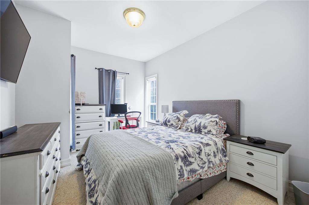 7387 Milam Road Winston, GA 30187 - Photo 31 of 41 a bedroom with a bed and a flat screen tv