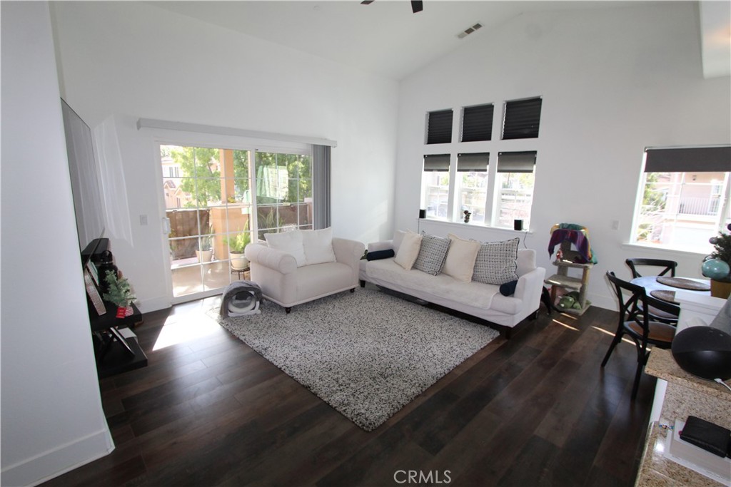 93 Kansas Street, Unit 802 Redlands, CA 92373 - Photo 3 of 29 a living room with furniture window and wooden floor