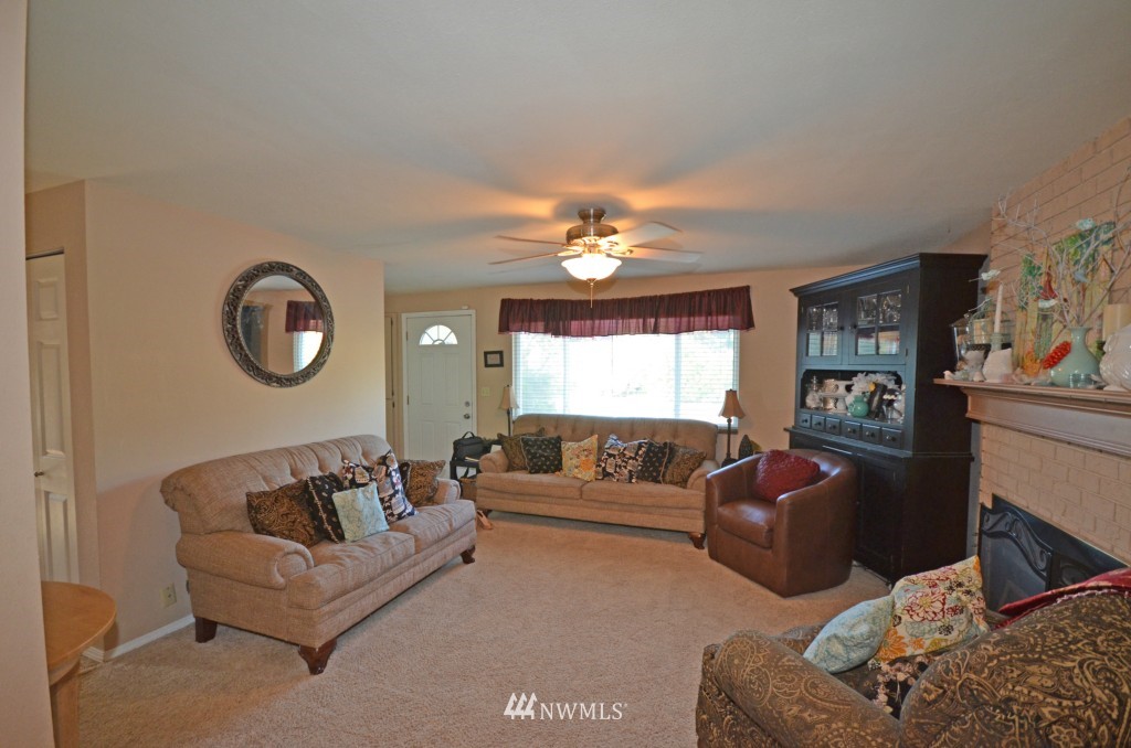 2608 165th Place Southeast Bothell, WA 98012 - Photo 11 of 13 a living room with furniture and a chandelier