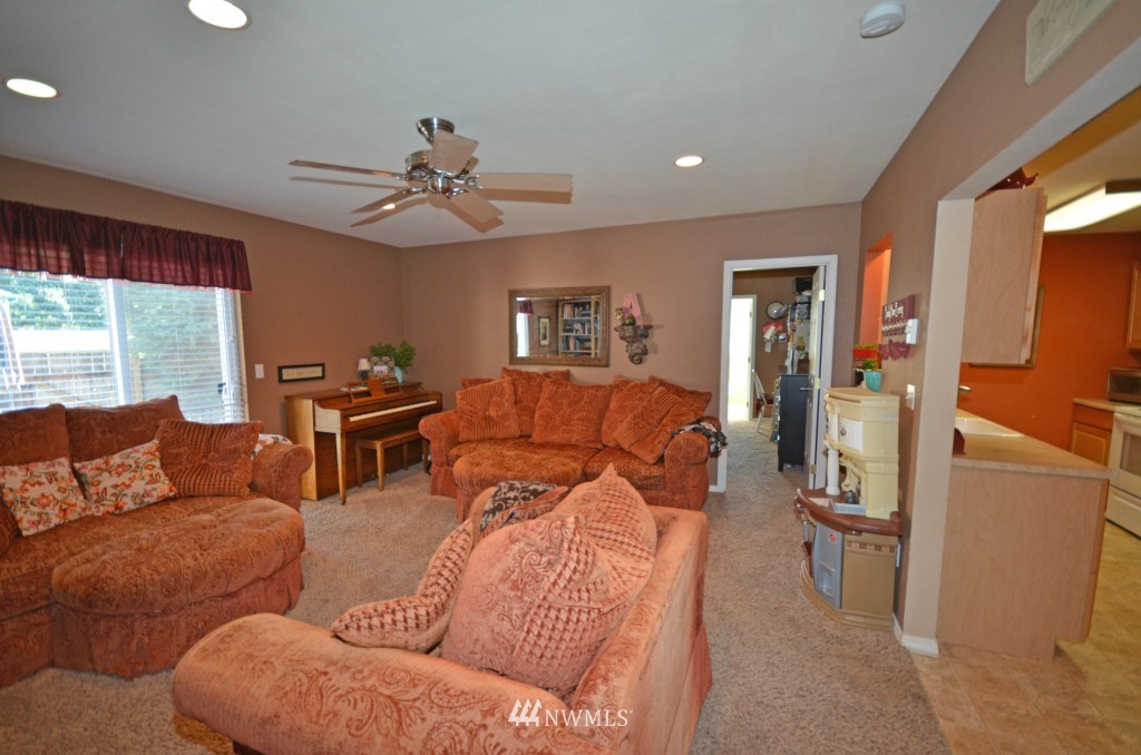 2608 165th Place Southeast Bothell, WA 98012 - Photo 3 of 13 a living room with furniture and a large window