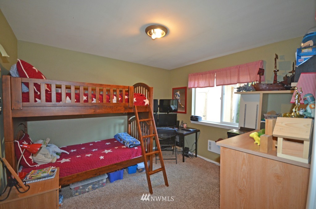 2608 165th Place Southeast Bothell, WA 98012 - Photo 7 of 13 a bedroom with furniture and a bed