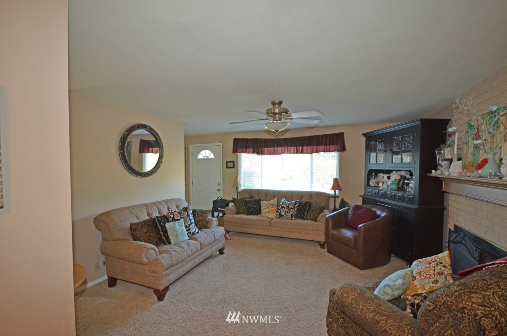 2608 165th Place Southeast Bothell, WA 98012 - Photo 8 of 13 a living room with furniture and a large window
