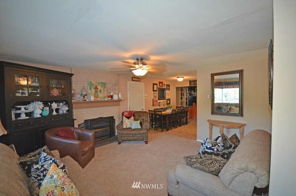 2608 165th Place Southeast Bothell, WA 98012 - Photo 9 of 13 a living room with furniture and a chandelier