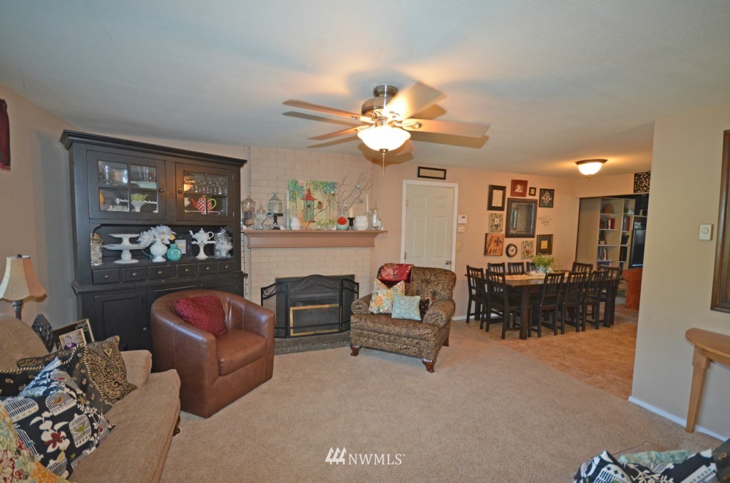2608 165th Place Southeast Bothell, WA 98012 - Photo 10 of 13 a living room with furniture fireplace and window
