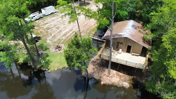 a aerial view of a house with a yard