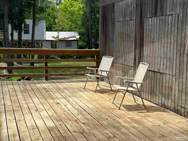 a view of a chairs and table on the wooden floor