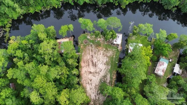 a view of a chairs and table in patio