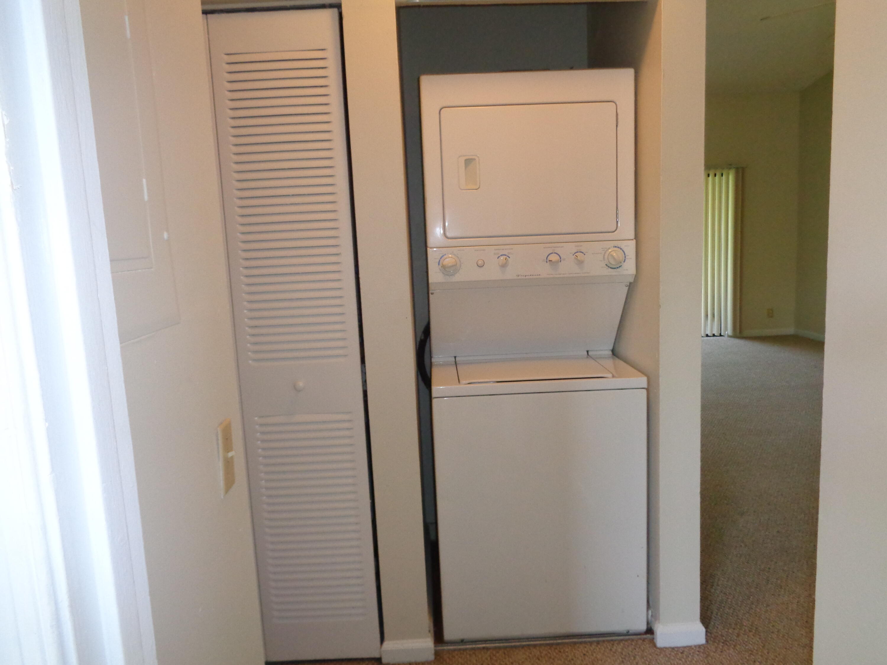 301 Olivewood Place, Unit O227 Boca Raton, FL 33431 - Photo 13 of 20 a utility room with dryer and washer