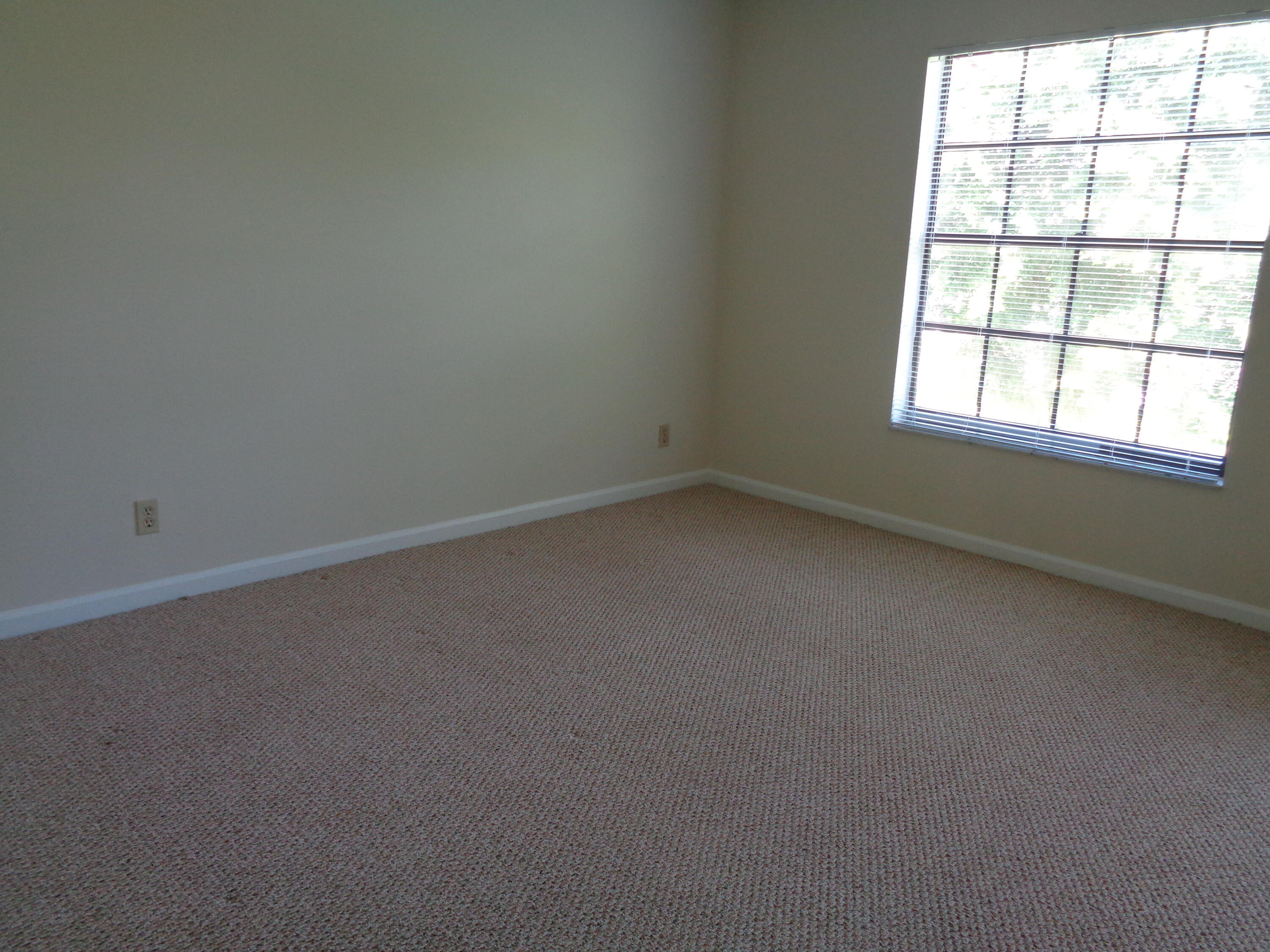 301 Olivewood Place, Unit O227 Boca Raton, FL 33431 - Photo 14 of 20 an empty room with a window