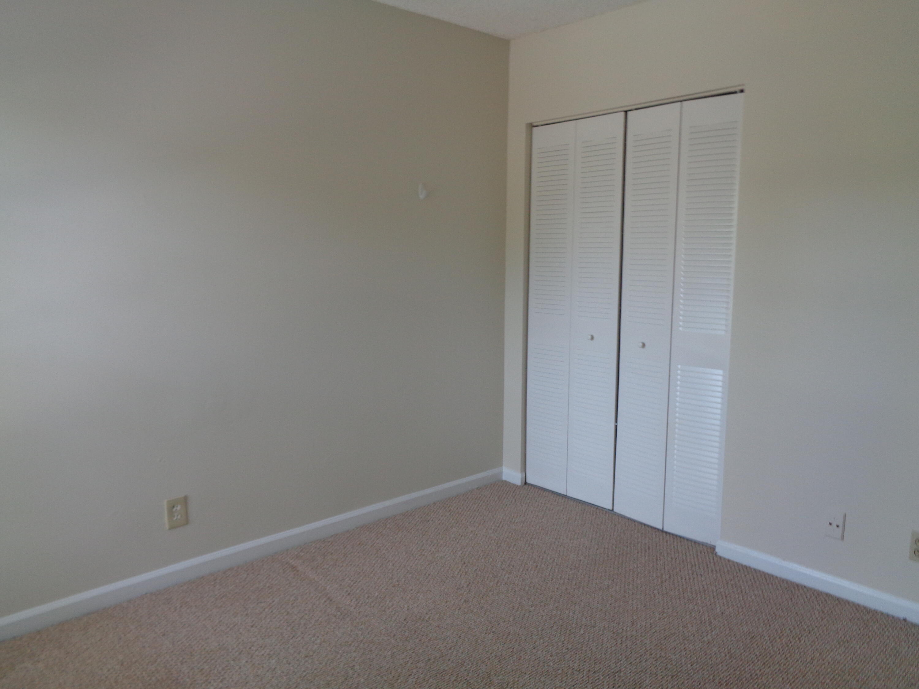 301 Olivewood Place, Unit O227 Boca Raton, FL 33431 - Photo 15 of 20 an empty room with closet area