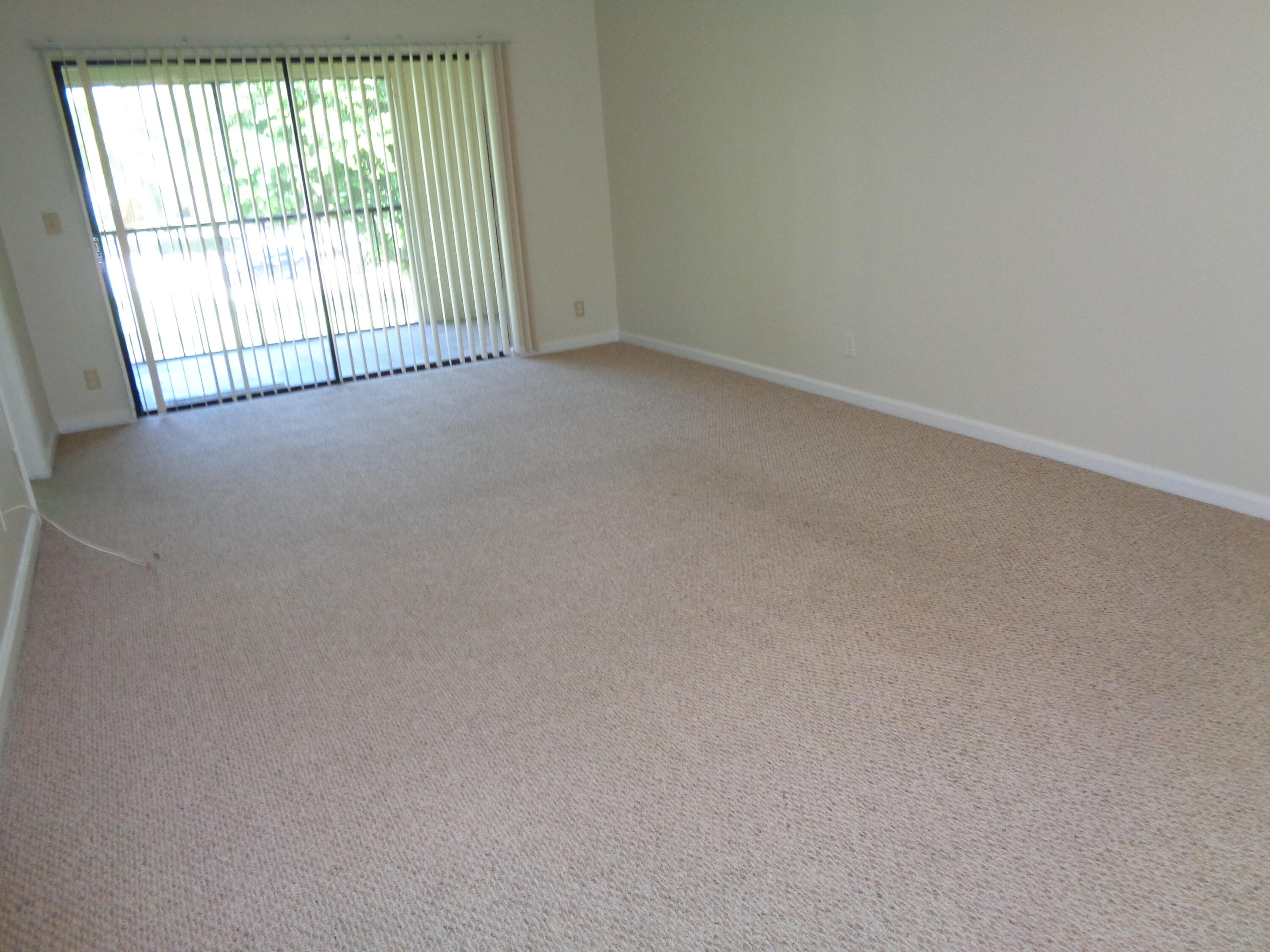 301 Olivewood Place, Unit O227 Boca Raton, FL 33431 - Photo 7 of 20 an empty room with windows