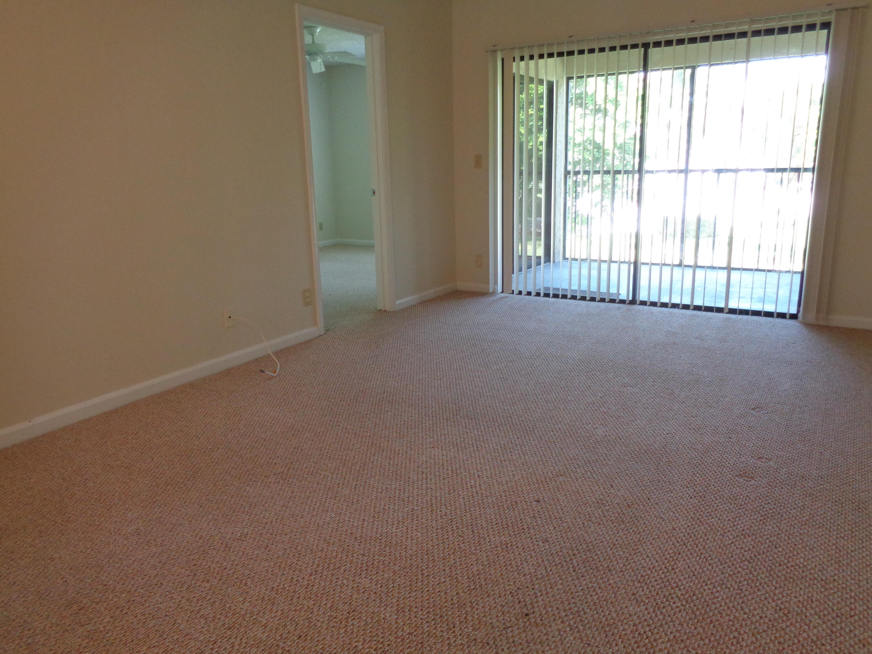 301 Olivewood Place, Unit O227 Boca Raton, FL 33431 - Photo 8 of 20 an empty room with a window
