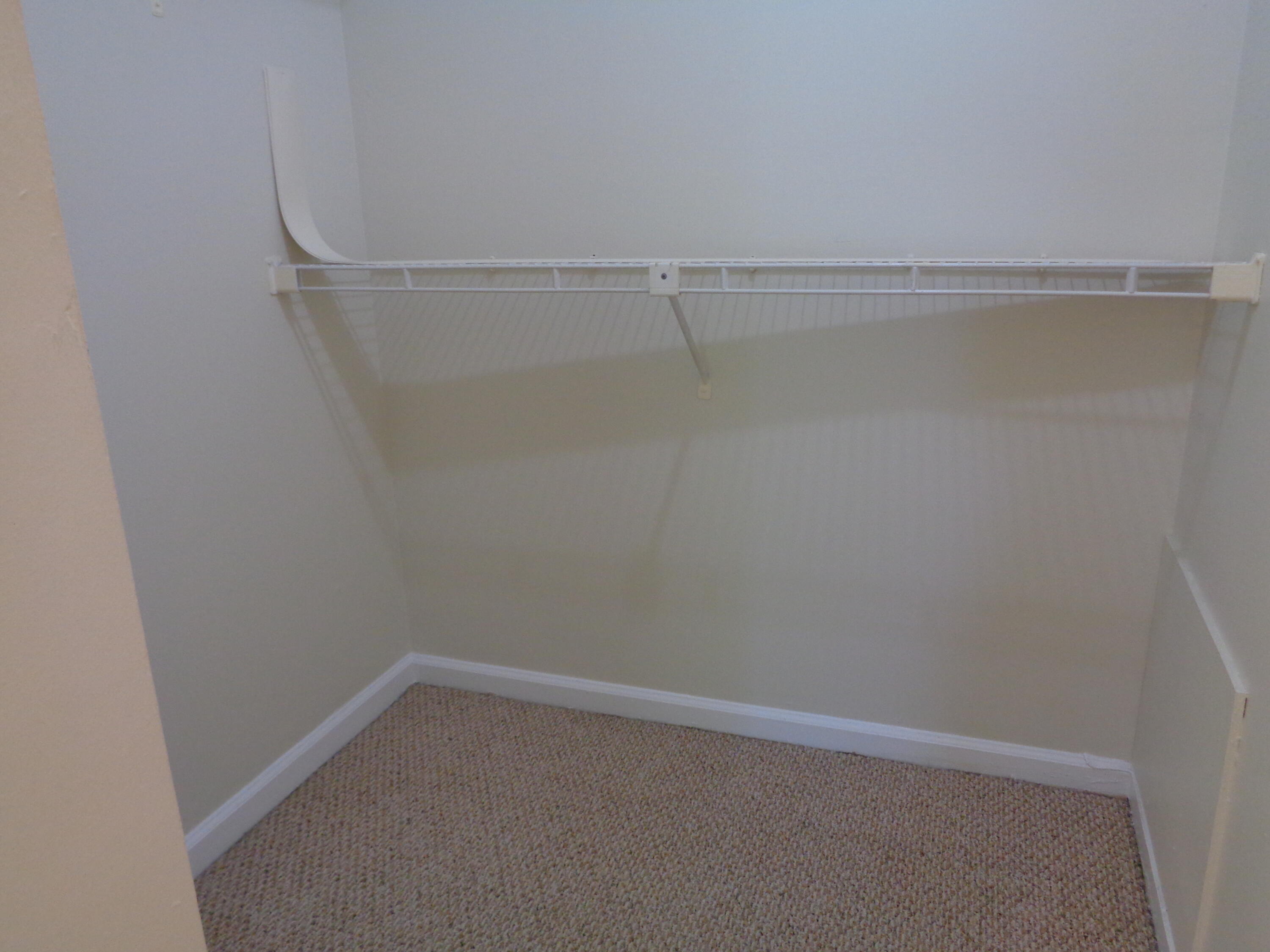 301 Olivewood Place, Unit O227 Boca Raton, FL 33431 - Photo 10 of 20 a view of an empty walk in closet