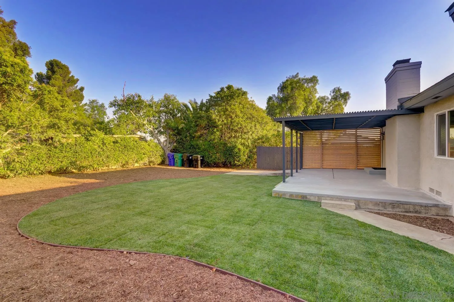 5701 Madra Avenue San Diego, CA 92120 - Photo 14 of 15 a view of a backyard with a fountain